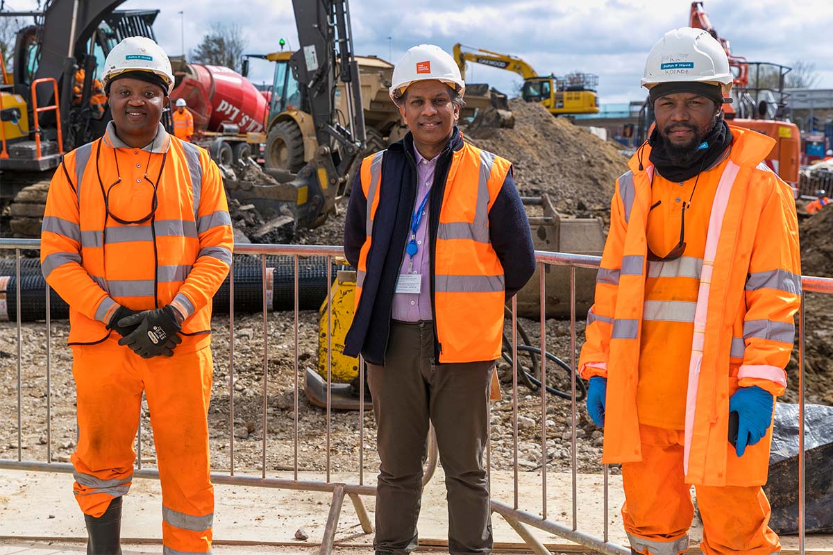 Three staff in high-viz on a construction site
