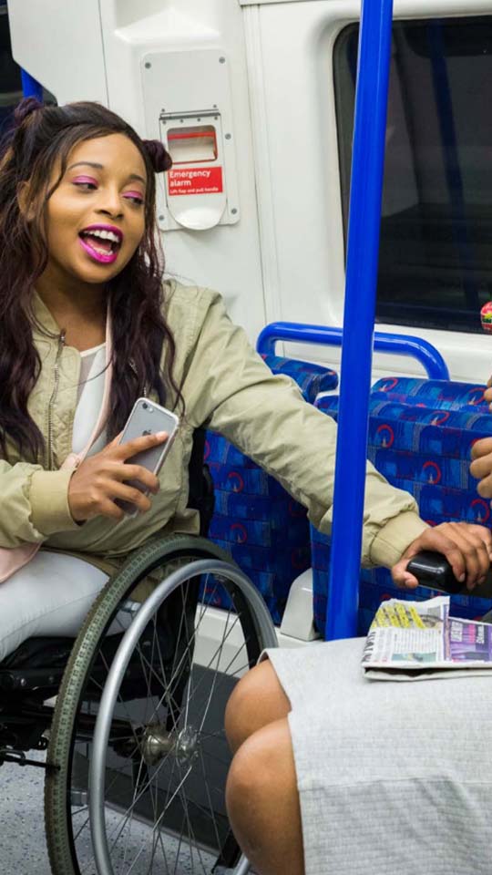 Young wheelchair user on a Tube